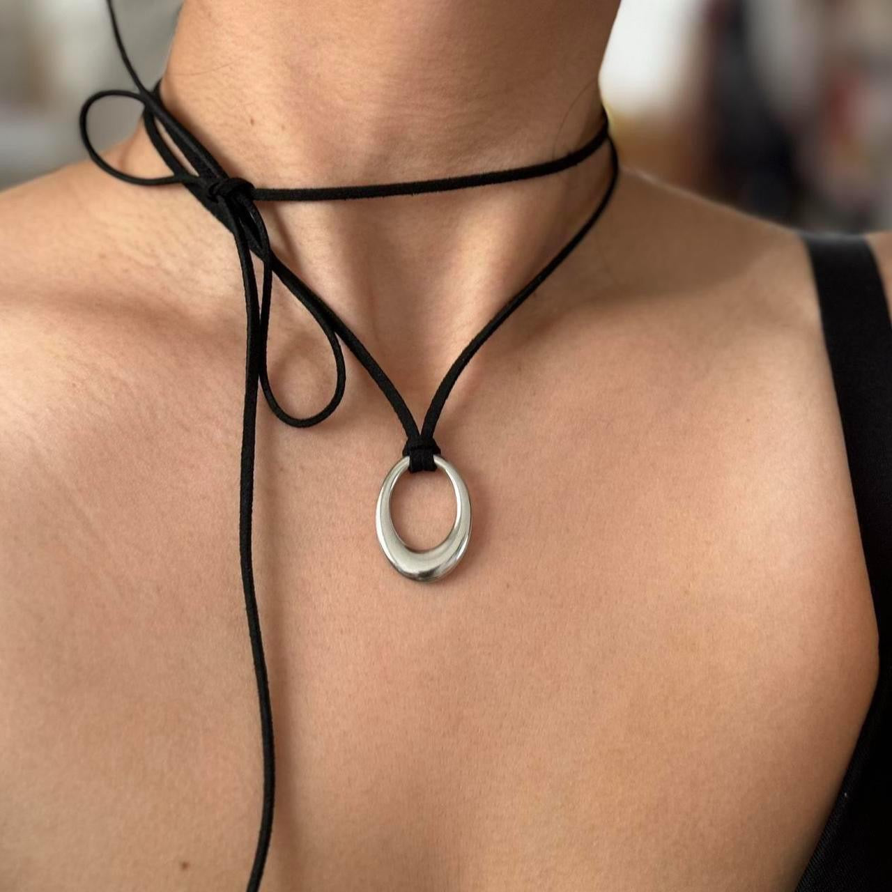 Chunky silver circular pendant corded necklace