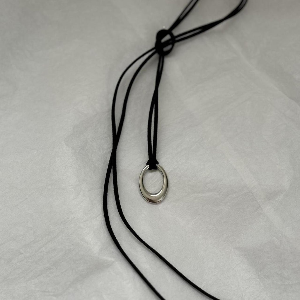 Chunky silver circular pendant corded necklace