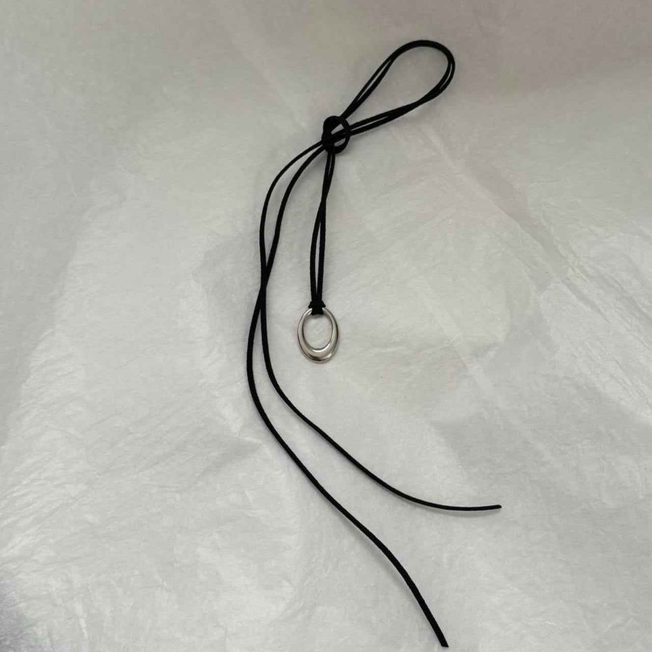 Chunky silver circular pendant corded necklace