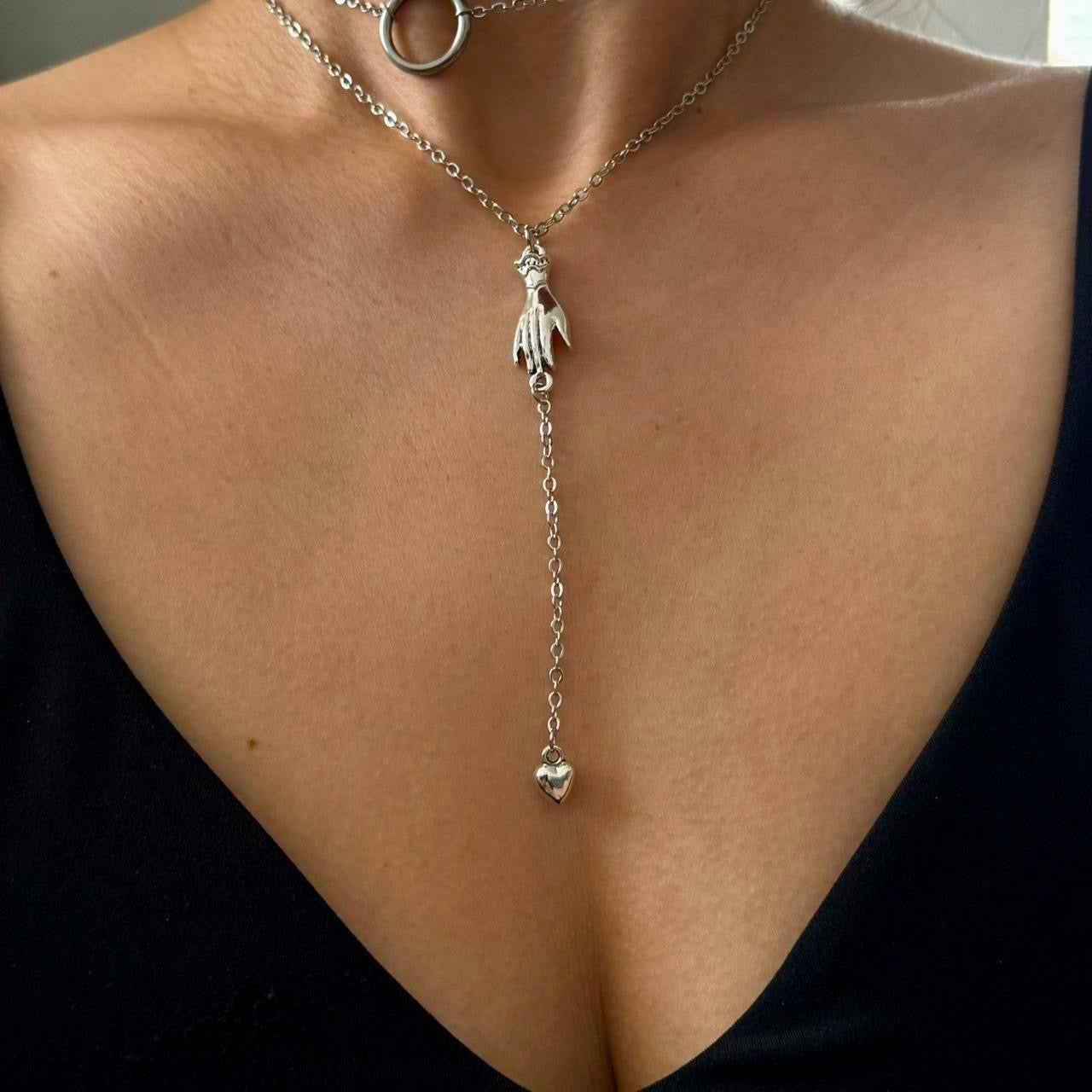 Hand with heart drop lariat necklace